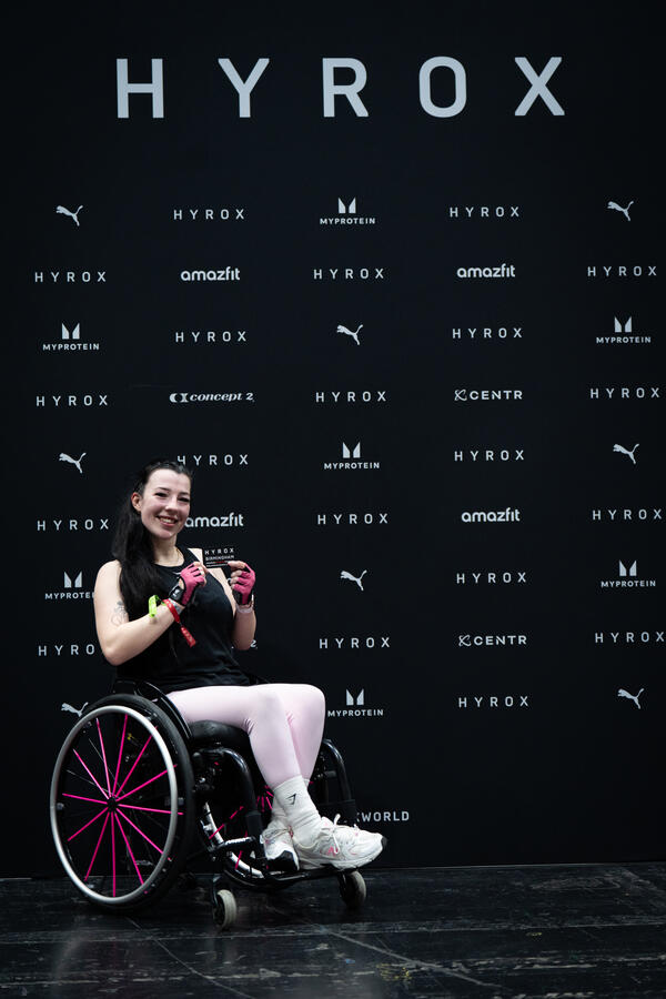 Adaptive athelete celebrating finishing of Hyrox race Adaptive athelete celebrating finishing of Hyrox race